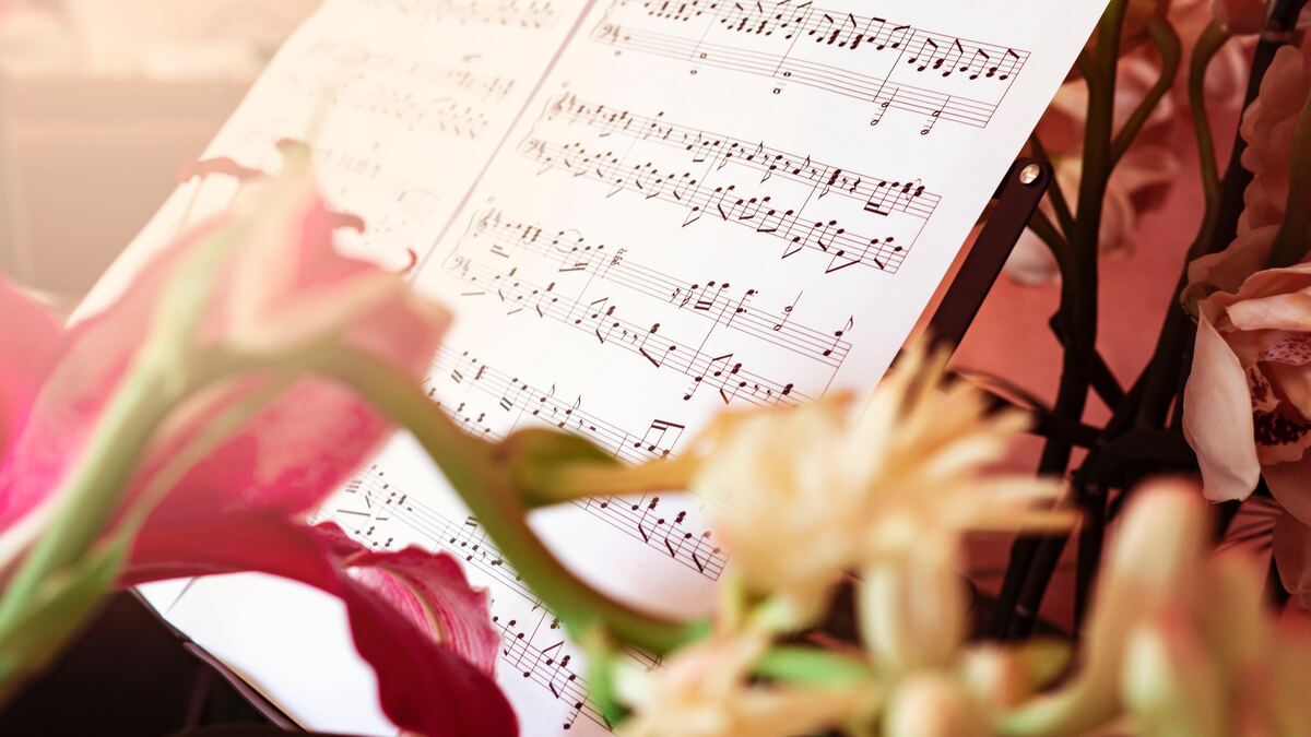 Sheet music with flowers in the foreground