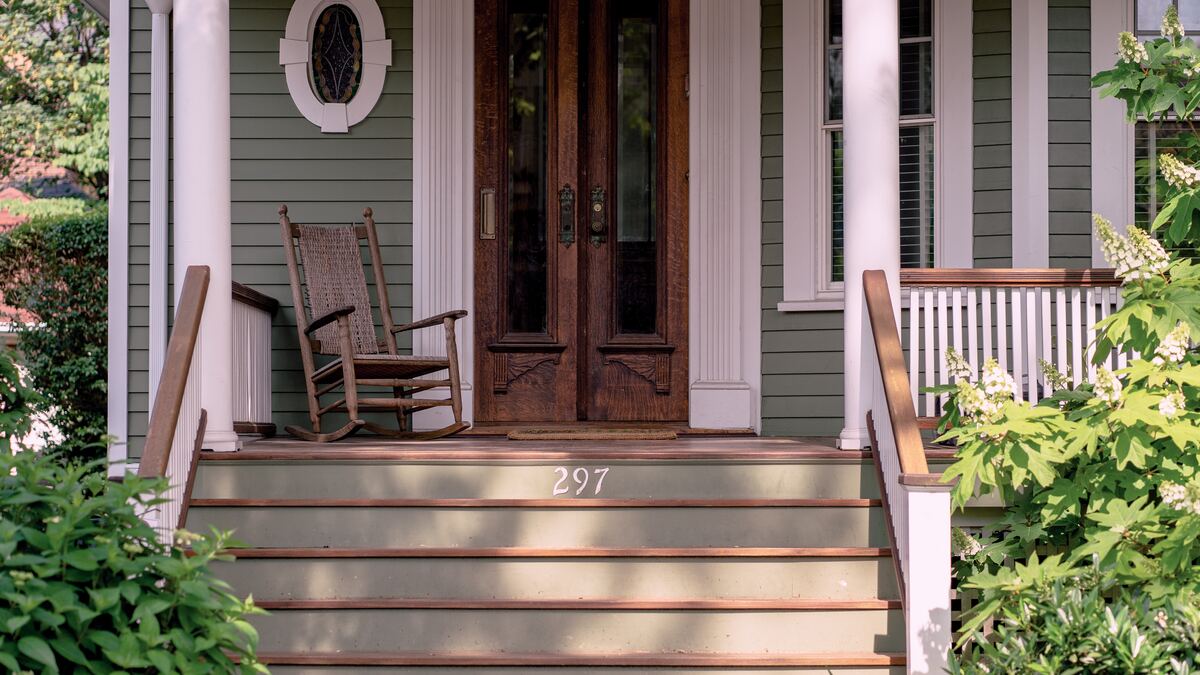 front porch of a home with a rocking chair
