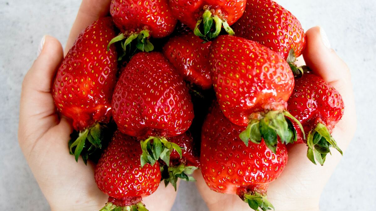 two handfuls of strawberries